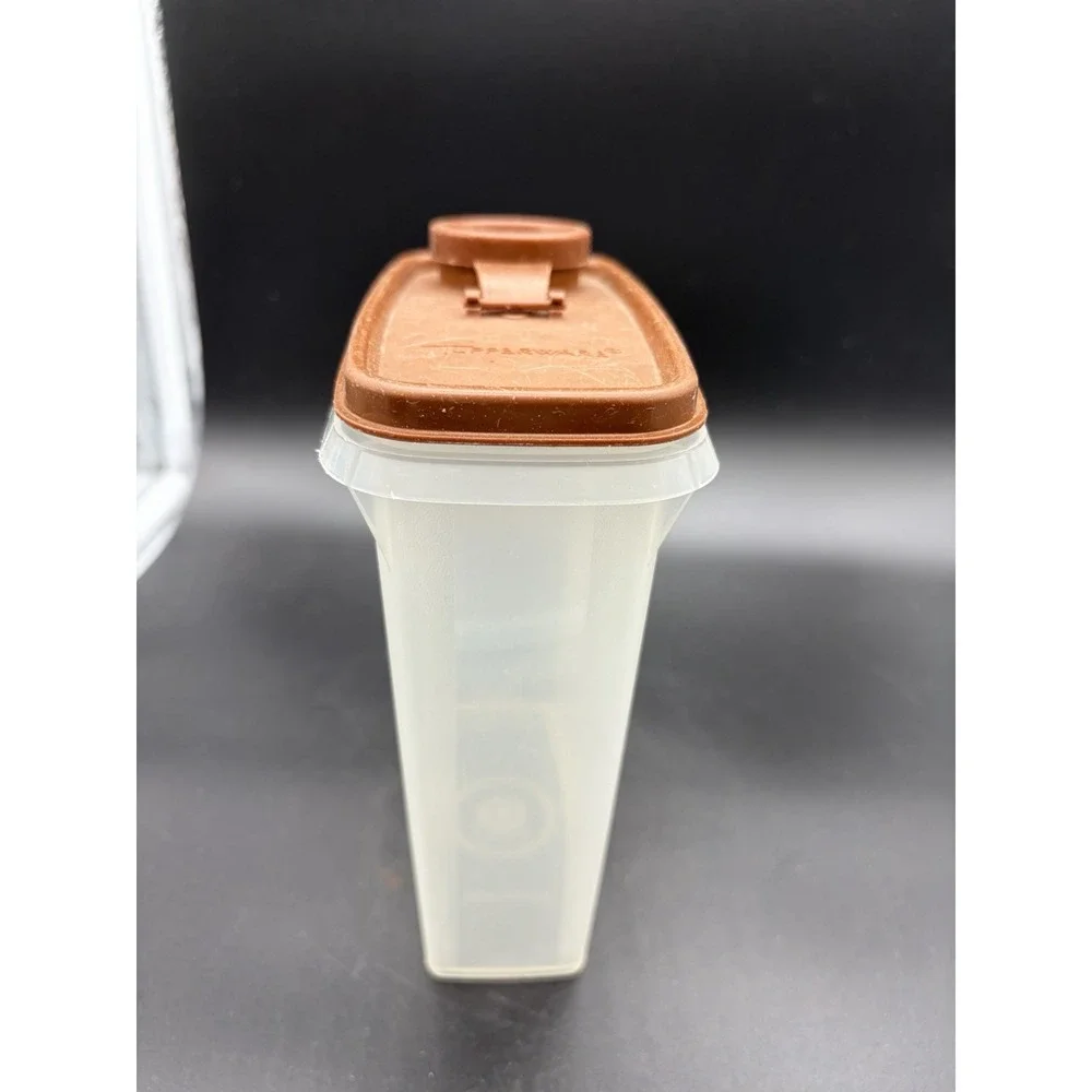 Vintage Mini Cereal Tupperware Container Bottom is 499-8 and‎ Top is 509-10.